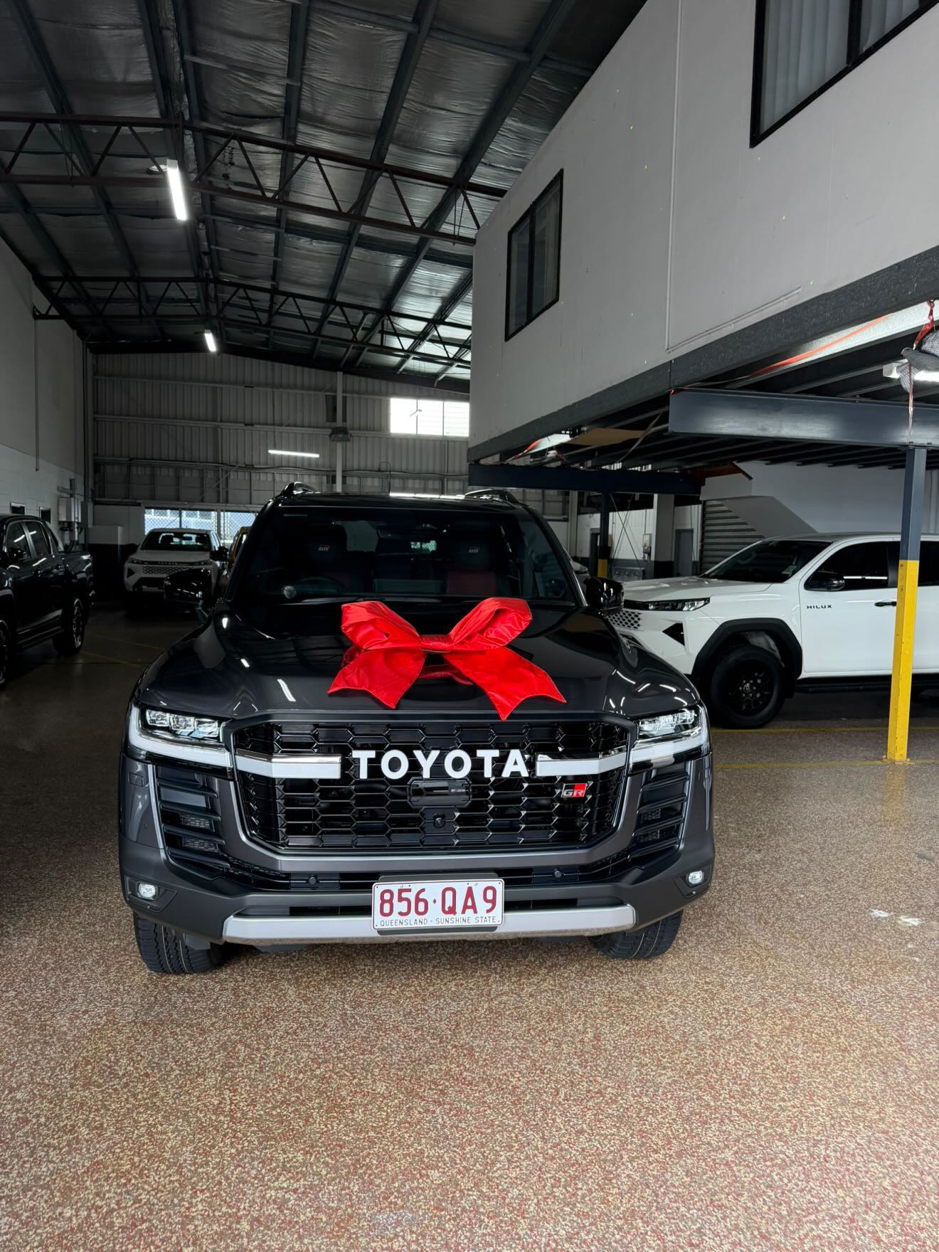 Customer's new Toyota LandCruiser with a delivery bow, financed through Simple Loans