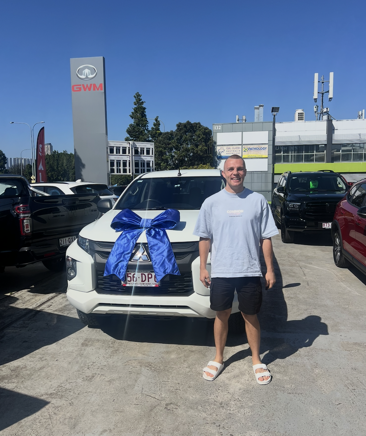 Customer collecting his new Mitsubishi SUV, financed through Simple Loans