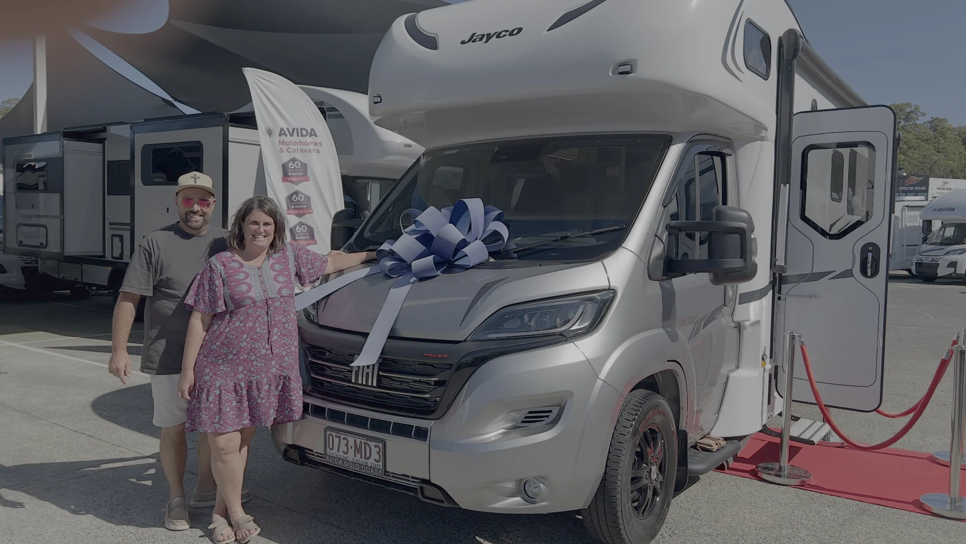 Couple collecting their financed Jayco motorhome