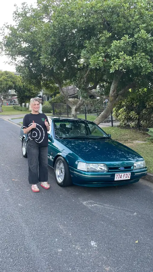 Customer with the used car she financed through Simple Loans