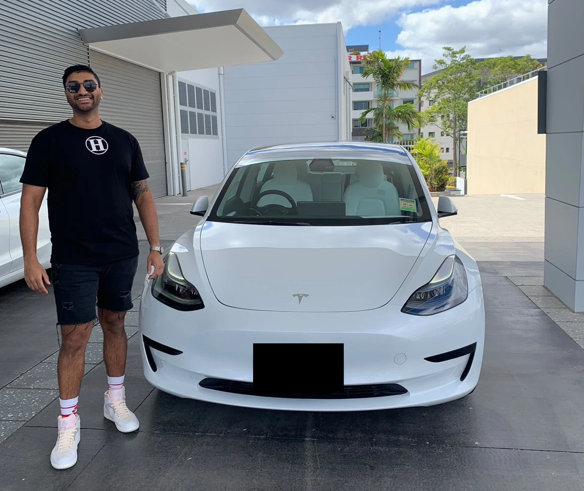 Customer with their financed electric vehicle