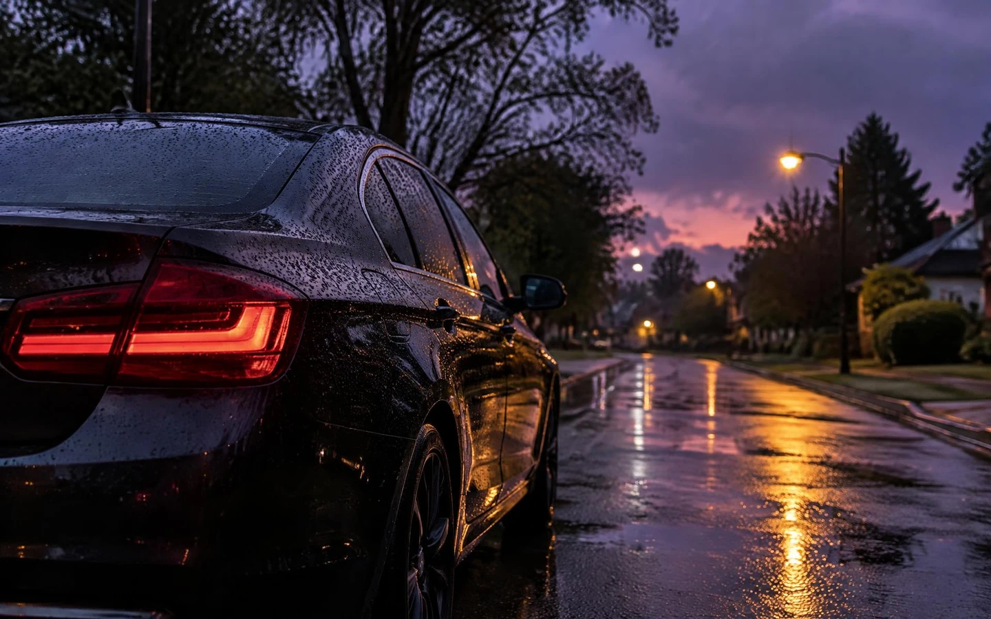 Umbrella sheltering a parked car in the rain