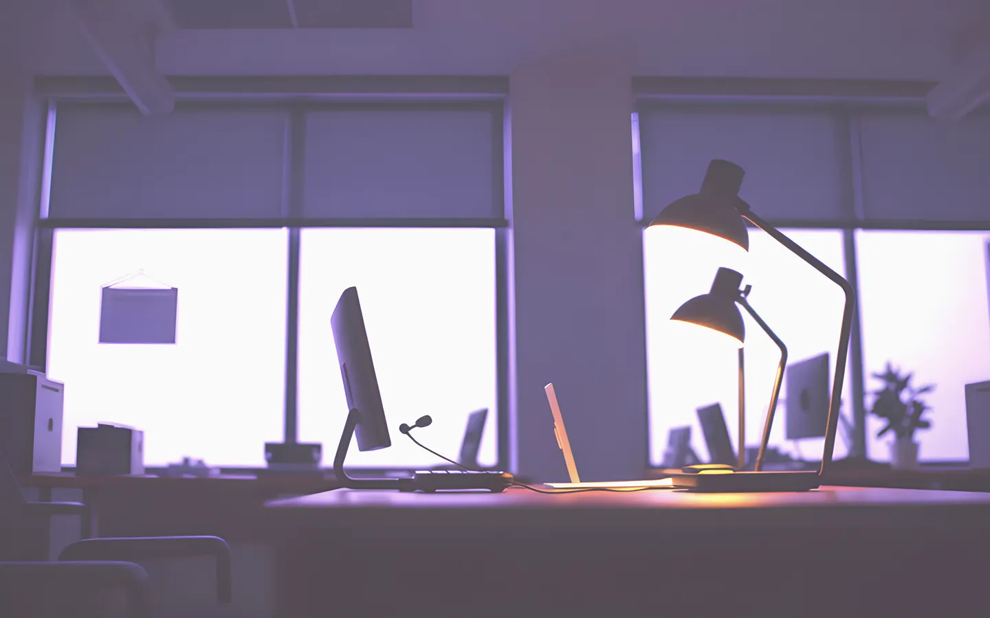 Help desk with headset and warm lamp light in an office